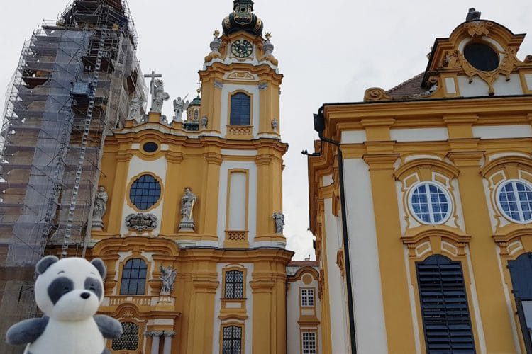 Plushie panda Mister Wong in front of the church inside of Melk Abbey. in the Wachau